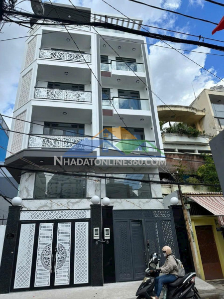 Bán nhà mặt tiền  ( 4.1m x 14.5m ) + 5 lầu thang máy + gần emart phan văn trị